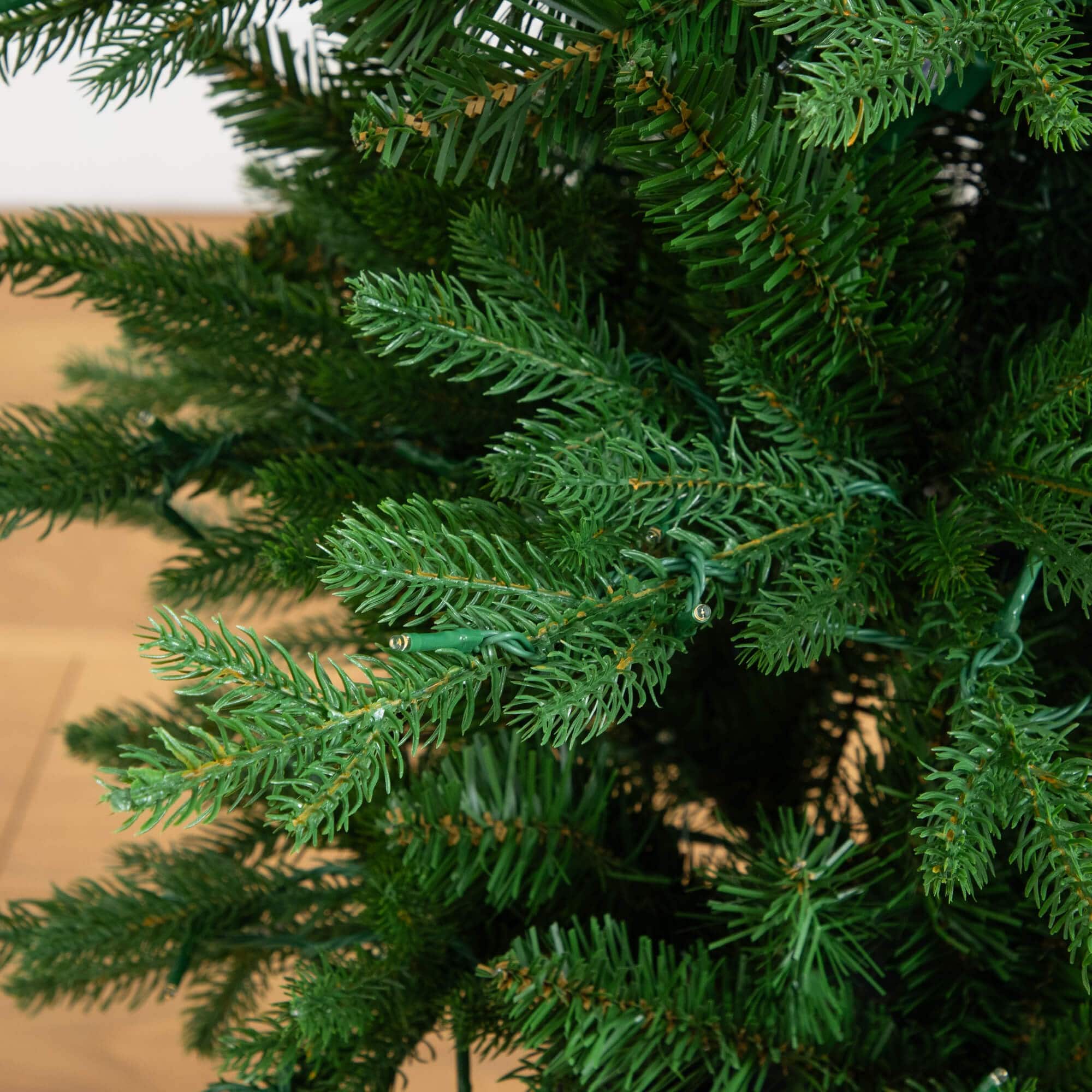 4.5ft. Pre-Lit Pine Artificial Christmas Tree in Decorative Planter with Clear LED Lights